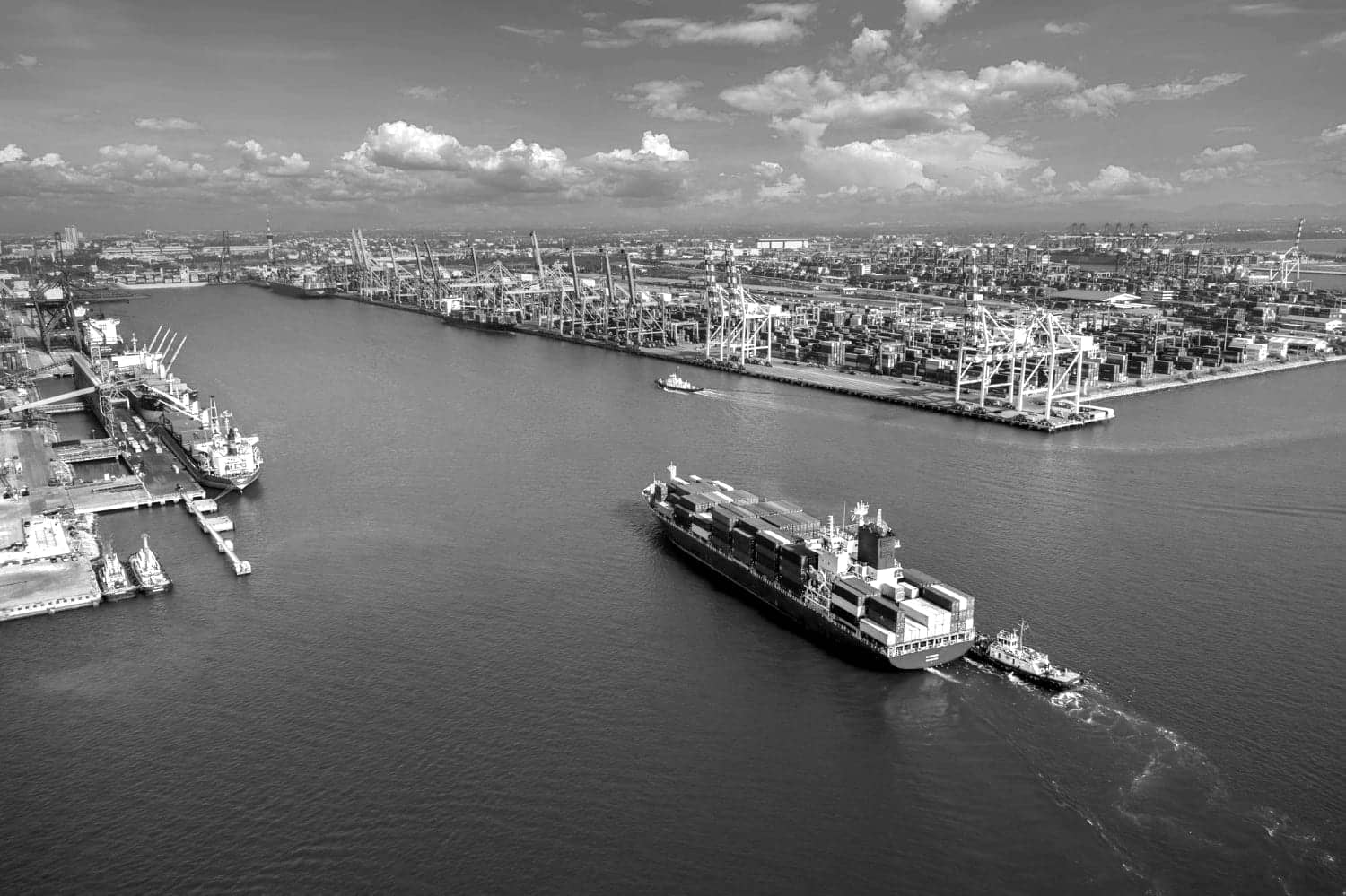 Container vessel leaving a busy port