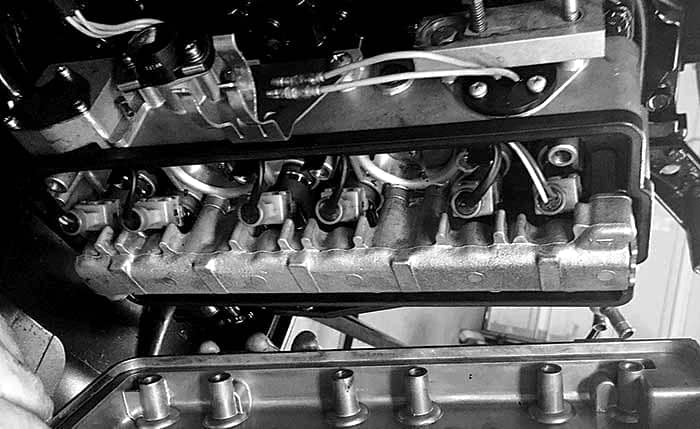 Fuel injectors being serviced on an engine